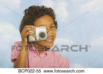Stock Image - young girl with 
a digital camera. 
fotosearch - search 
stock photos, 
pictures, images, 
and photo clipart