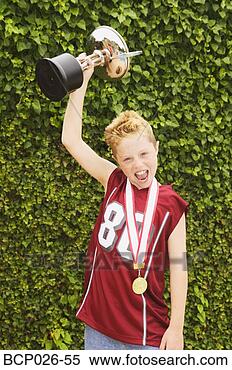 Stock Image - boy holding a 
trophy. fotosearch 
- search stock 
photos, pictures, 
images, and photo 
clipart