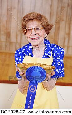 Picture - woman holding 
her award winning 
pie. fotosearch 
- search stock 
photos, pictures, 
images, and photo 
clipart