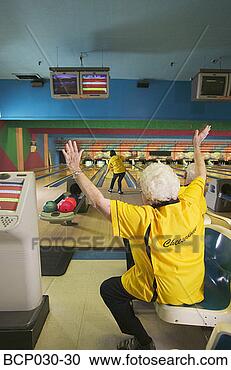 Stock Photography - female bowler 
cheering for her 
teammate. fotosearch 
- search stock 
photos, pictures, 
images, and photo 
clipart