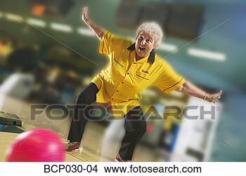 Stock Photo - female bowler 
rolls a great 
game. fotosearch 
- search stock 
photos, pictures, 
images, and photo 
clipart
