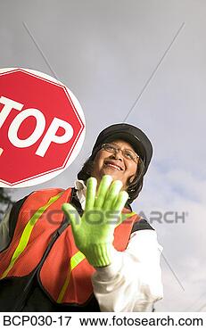 Picture - a female crossing 
guard at work. 
fotosearch - search 
stock photos, 
pictures, images, 
and photo clipart