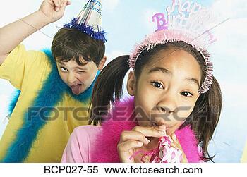 Stock Image - boy and girl in 
party hats. fotosearch 
- search stock 
photos, pictures, 
images, and photo 
clipart