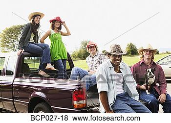 Stock Photo - people hanging 
out in the back 
of a pick up truck. 
fotosearch - search 
stock photos, 
pictures, images, 
and photo clipart