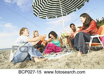 Stock Image - people relaxing 
at a beach party. 
fotosearch - search 
stock photos, 
pictures, images, 
and photo clipart