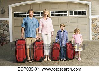 Picture - family standing 
together with 
luggage. fotosearch 
- search stock 
photos, pictures, 
images, and photo 
clipart