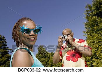 Stock Photo - man taking snapshot 
of woman. fotosearch 
- search stock 
photos, pictures, 
images, and photo 
clipart