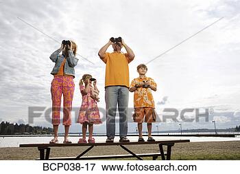 Picture - family using binoculars. 
fotosearch - search 
stock photos, 
pictures, images, 
and photo clipart