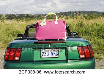 Stock Photo - still life of 
pink tote bag 
and car. fotosearch 
- search stock 
photos, pictures, 
images, and photo 
clipart