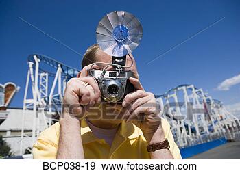 Stock Photograph - tourist taking 
a photograph. 
fotosearch - search 
stock photos, 
pictures, images, 
and photo clipart