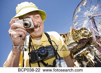 Stock Photo - tourist taking 
a photograph. 
fotosearch - search 
stock photos, 
pictures, images, 
and photo clipart