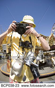 Stock Photo - tourist taking 
a photograph. 
fotosearch - search 
stock photos, 
pictures, images, 
and photo clipart