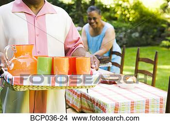 Stock Photo - carrying beverages 
for a party. fotosearch 
- search stock 
photos, pictures, 
images, and photo 
clipart