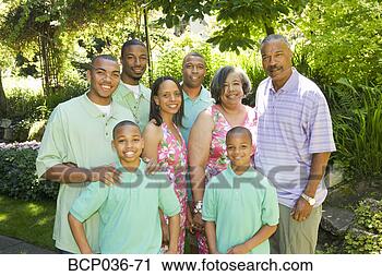 Stock Photography - family posing 
outdoors. fotosearch 
- search stock 
photos, pictures, 
images, and photo 
clipart