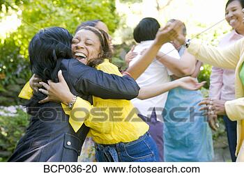 Stock Photography - females hugging 
outdoors. fotosearch 
- search stock 
photos, pictures, 
images, and photo 
clipart