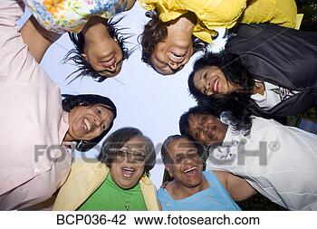 Stock Photo - low angle view 
of lively females. 
fotosearch - search 
stock photos, 
pictures, images, 
and photo clipart