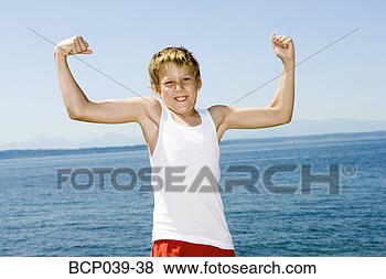 Stock Photo - young boy flexing 
his muscles. fotosearch 
- search stock 
photos, pictures, 
images, and photo 
clipart