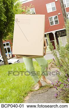 Stock Photography - woman carrying 
a heavy box. fotosearch 
- search stock 
photos, pictures, 
images, and photo 
clipart