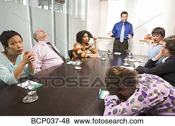 Stock Photo - bored and tired 
co-workers in 
meeting. fotosearch 
- search stock 
photos, pictures, 
images, and photo 
clipart