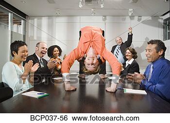 Stock Photo - businesswoman 
doing backbend 
at meeting. fotosearch 
- search stock 
photos, pictures, 
images, and photo 
clipart