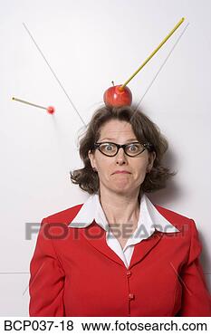 Stock Photo - shooting an apple 
off businesswoman's 
head. fotosearch 
- search stock 
photos, pictures, 
images, and photo 
clipart