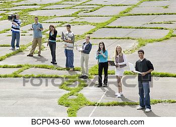 Stock Photography - teenagers holding 
electronic gadgets. 
fotosearch - search 
stock photos, 
pictures, images, 
and photo clipart