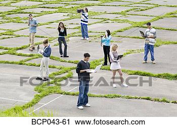 Stock Photography - teenagers using 
electronic gadgets. 
fotosearch - search 
stock photos, 
pictures, images, 
and photo clipart