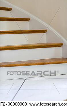 Stock Photography - section of a curved 
staircase is seen 
during the day. 
fotosearch - search 
stock photos, 
pictures, images, 
and photo clipart