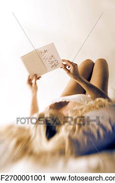A woman lays in bed and reads a love note
View Large Photo Image Stock Photography - a woman lays in
bed and reads
a love note. fotosearch
- search stock
photos, pictures,
images, and photo
clipart