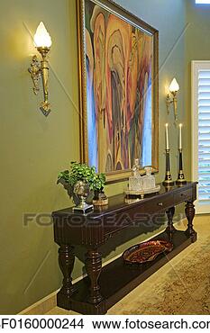 Stock Photo - a large artistic 
painting is seen 
in between two 
lamps. fotosearch 
- search stock 
photos, pictures, 
images, and photo 
clipart