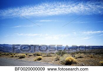 Stock Photograph - a vast mountainous 
region is seen 
in a remote area. 
fotosearch - search 
stock photos, 
pictures, images, 
and photo clipart