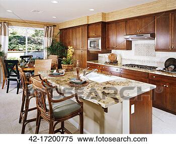 Stock Image - traditional kitchen 
with island and 
dining table. 
fotosearch - search 
stock photos, 
pictures, images, 
and photo clipart