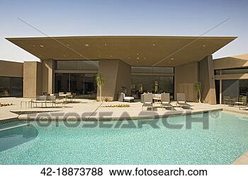 Stock Photo - pool and patio 
behind contemporary 
home. fotosearch 
- search stock 
photos, pictures, 
images, and photo 
clipart