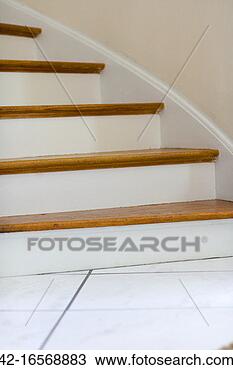 Stock Photo - section of a curved 
staircase is seen 
during the day. 
fotosearch - search 
stock photos, 
pictures, images, 
and photo clipart