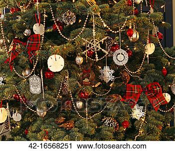 Stock Photography - decorations with 
bows seen on the 
christmas tree. 
fotosearch - search 
stock photos, 
pictures, images, 
and photo clipart