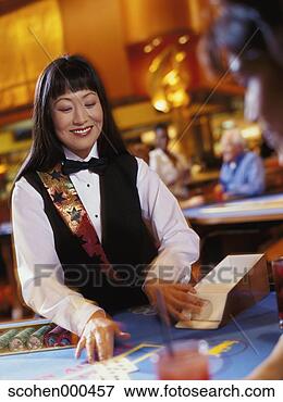 Picture - female croupier 
at a casino. fotosearch 
- search stock 
photos, pictures, 
images, and photo 
clipart