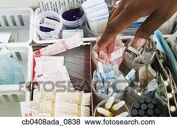 Stock Photo - hand reaching 
for medical supplies. 
fotosearch - search 
stock photos, 
pictures, images, 
and photo clipart