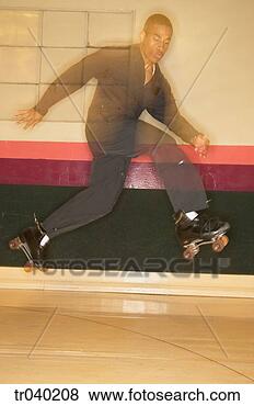 Stock Photo - man jumping on 
roller skates 
at a roller skating 
rink. fotosearch 
- search stock 
photos, pictures, 
images, and photo 
clipart