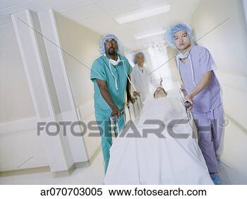 Stock Image - medical professionals 
pushing a patient 
on a gurney in 
a hospital. fotosearch 
- search stock 
photos, pictures, 
images, and photo 
clipart