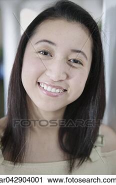 Stock Photography - portrait of a 
young woman smiling. 
fotosearch - search 
stock photos, 
pictures, images, 
and photo clipart