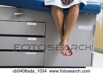 Stock Photo - view of a patient's 
legs dangling 
from a bed. fotosearch 
- search stock 
photos, pictures, 
images, and photo 
clipart