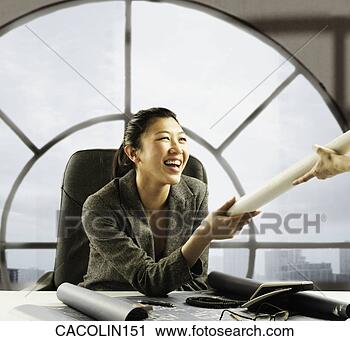 Stock Photography - young businesswoman 
holding a rolled 
document. fotosearch 
- search stock 
photos, pictures, 
images, and photo 
clipart
