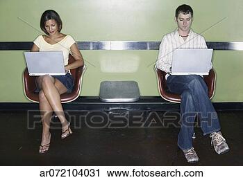 Stock Photography - young couple working 
on laptops. fotosearch 
- search stock 
photos, pictures, 
images, and photo 
clipart