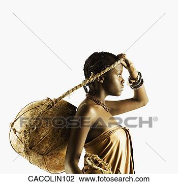 Stock Photo - young tribal woman 
carrying a pot 
suspended from 
her head. fotosearch 
- search stock 
photos, pictures, 
images, and photo 
clipart