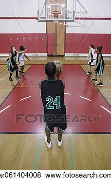 Stock Photo - team of female 
teenage basketball 
players playing 
basketball on 
a. fotosearch 
- search stock 
photos, pictures, 
images, and photo 
clipart