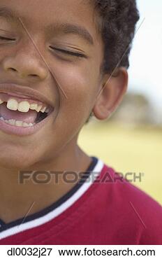 Picture - young boy laughing 
with his eyes 
closed. fotosearch 
- search stock 
photos, pictures, 
images, and photo 
clipart