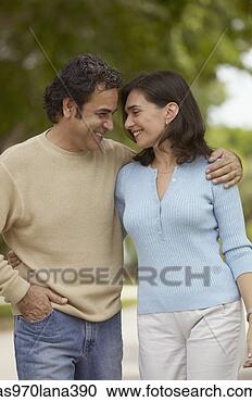 Stock Photography - mid adult couple 
standing close 
to each other. 
fotosearch - search 
stock photos, 
pictures, images, 
and photo clipart