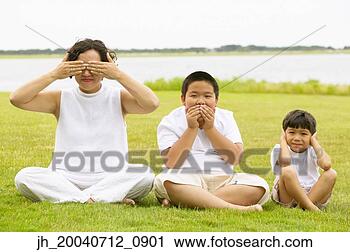 Stock Photography - mid adult woman 
and two young 
boys signing hear 
no evil,  see 
no. fotosearch 
- search stock 
photos, pictures, 
images, and photo 
clipart