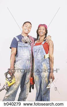 Stock Photograph - portrait of a 
couple holding 
power tools. fotosearch 
- search stock 
photos, pictures, 
images, and photo 
clipart