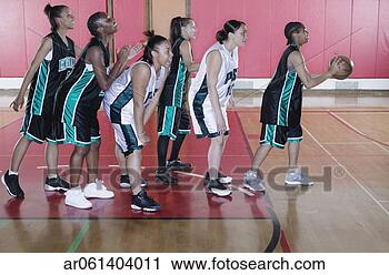 Stock Photography - team of female 
teenage basketball 
players doing 
drill exercises. 
fotosearch - search 
stock photos, 
pictures, images, 
and photo clipart